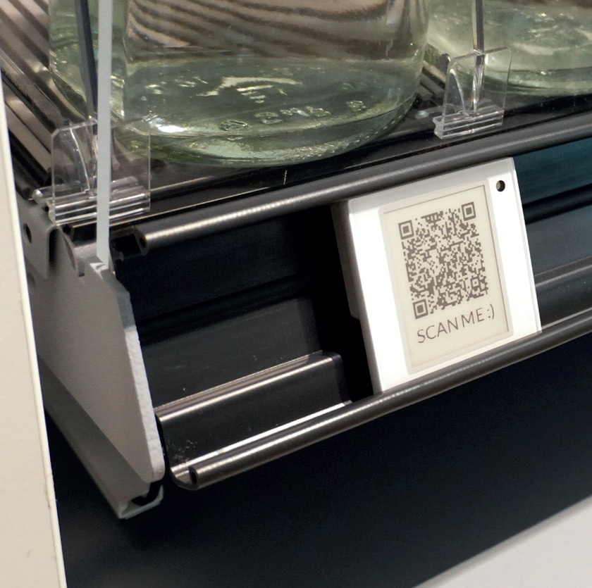 ESL BumperRail from POS Tuning installed on gondola shelf rail protecting electronic shelf labels